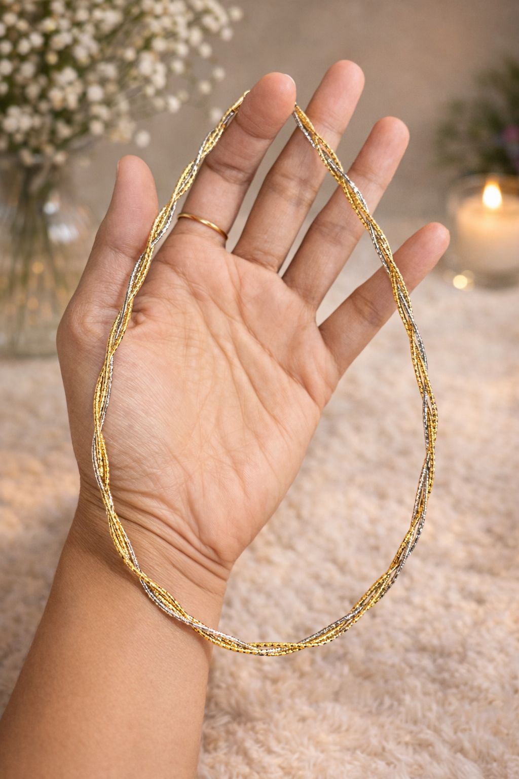 Stylish twisted rope necklace in a dual-tone gold and silver finish